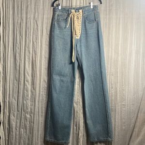 These are wide flare jeans with a lace tie in front. They are a medium fit.